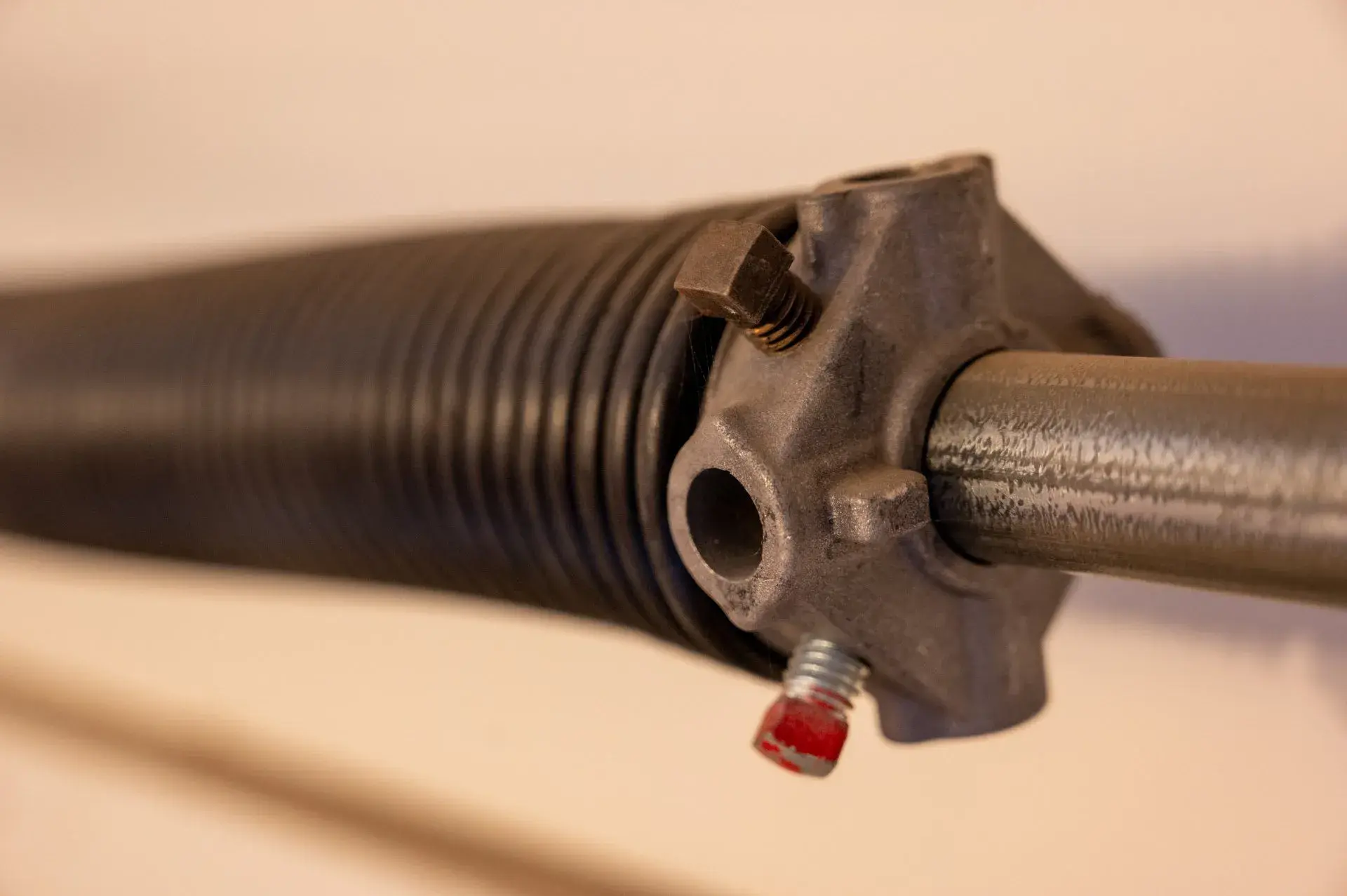 Close-up of a garage door torsion spring