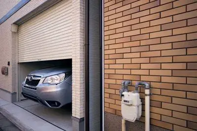 Roller door raised above a parked car