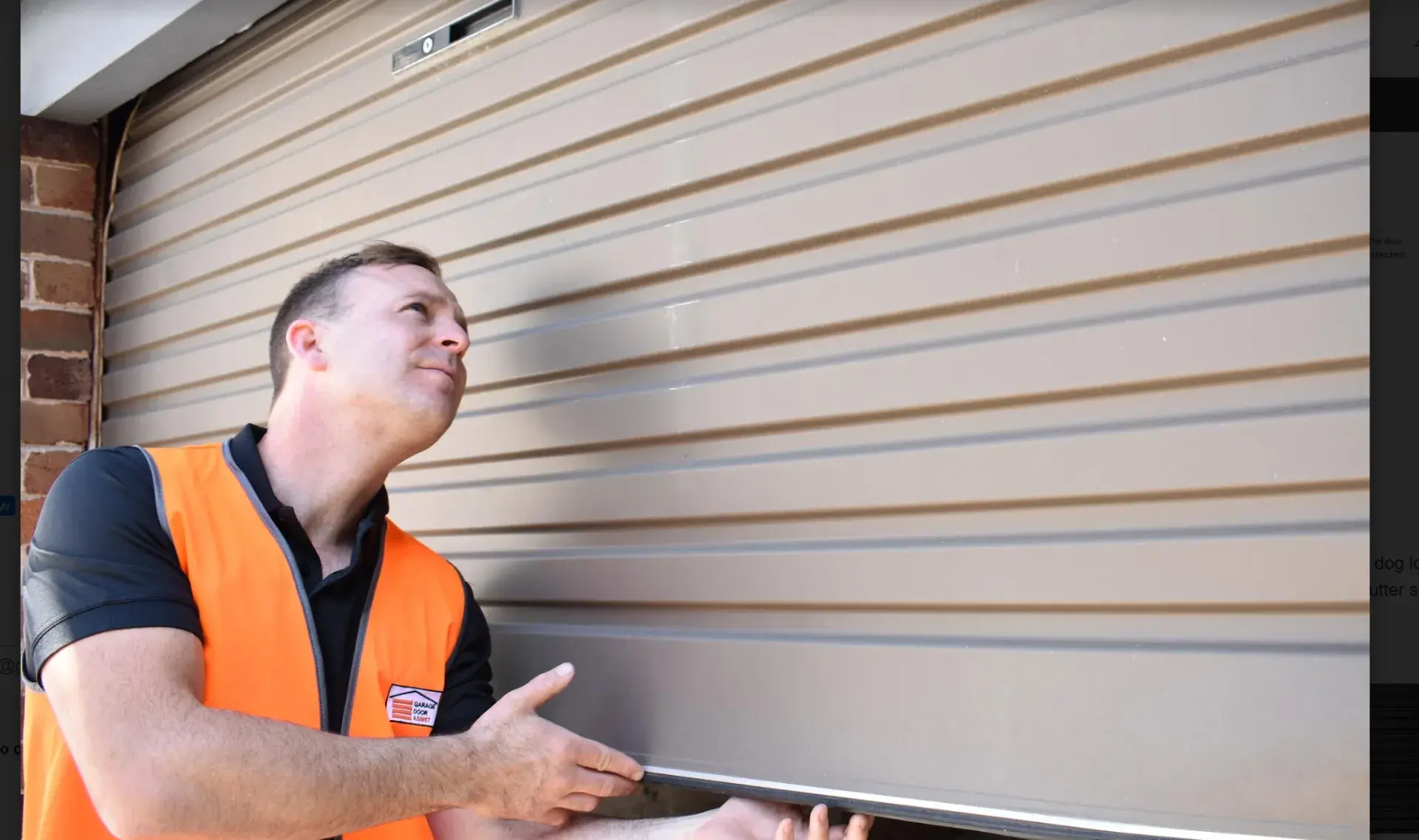 Garage Door Assist technician inspecting a roller door