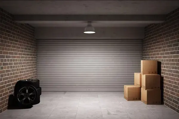 Closed roller door inside a brick garage